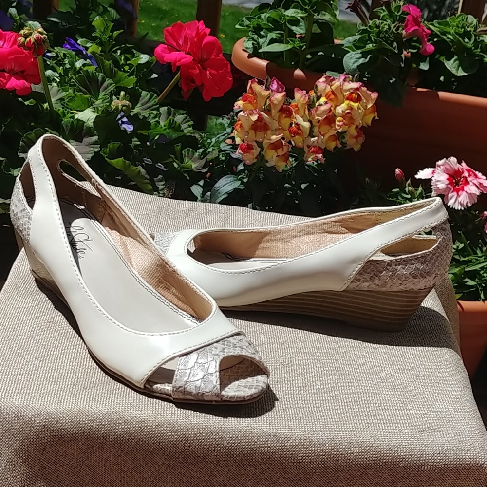 Creme and snakeskin peep toe wedges